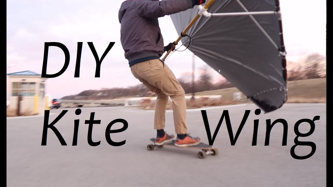 riding DIY home made kitewing windwing skimbat in milwaukee ssyc on a skateboard