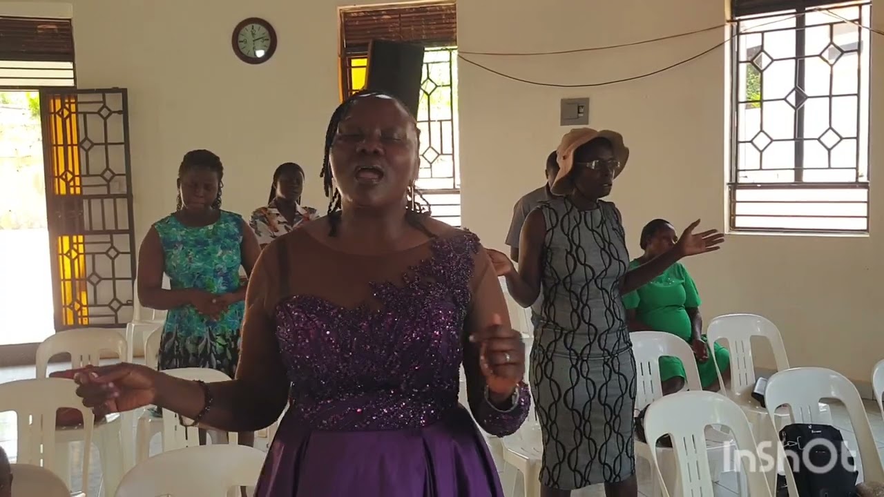 Praising by Pastor Hellen Namuluya 