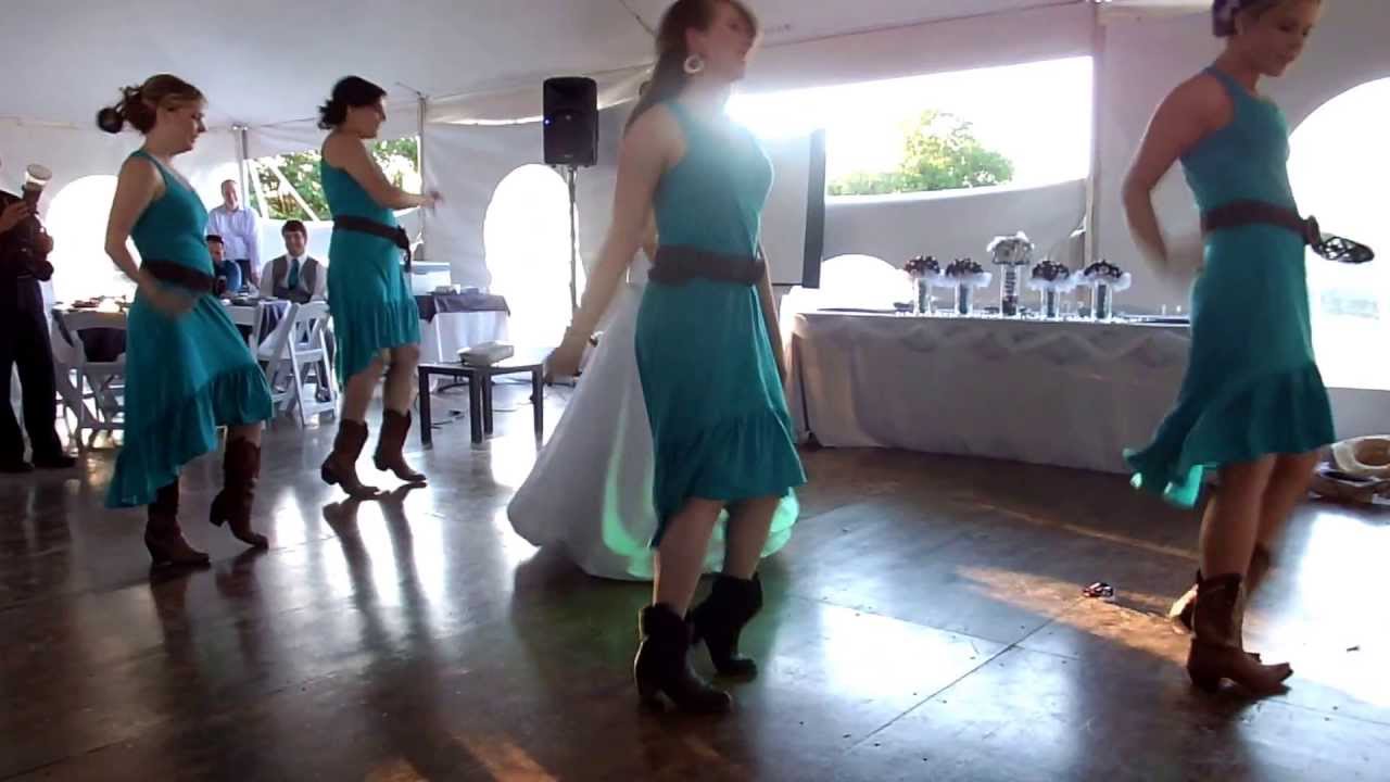 Bride and bridesmaids surprise groom and guests with a wedding dance!