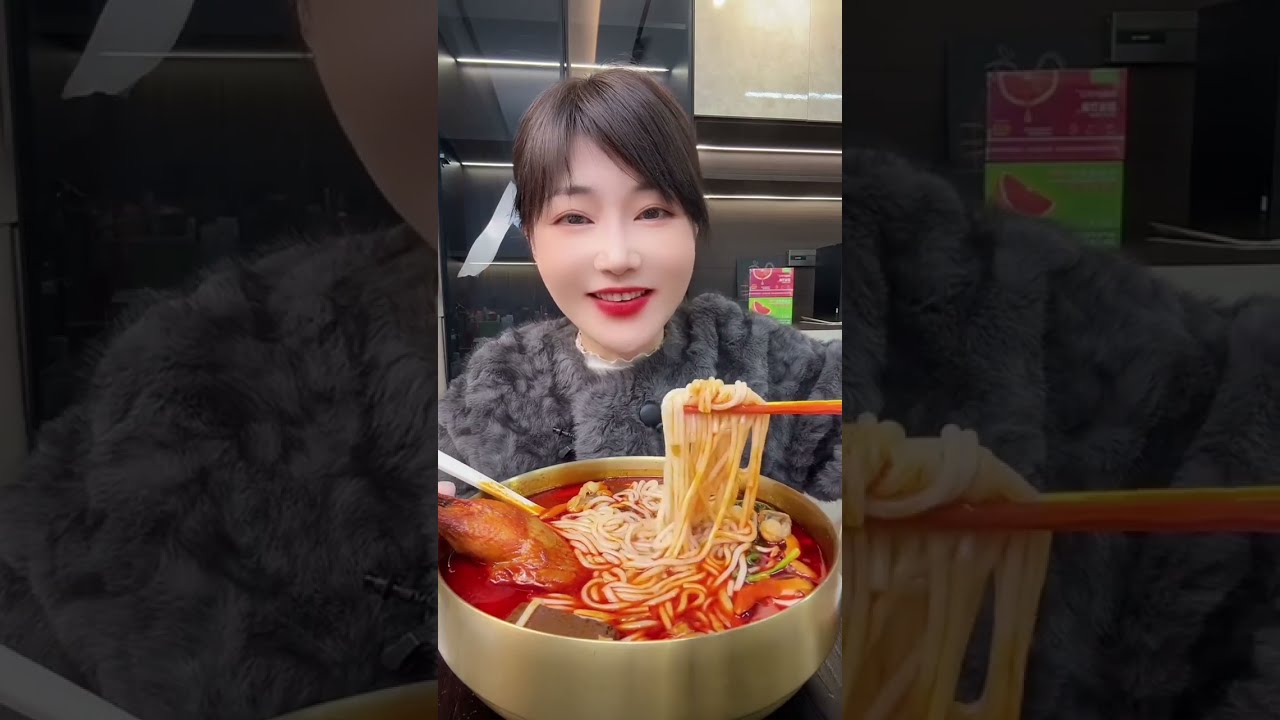 Eating delicious spicy noodles and chicken legs 