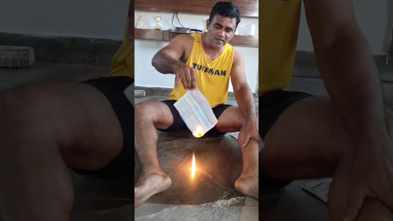 Activist Xencor Polgi burns power bill to protest hike in tariff.