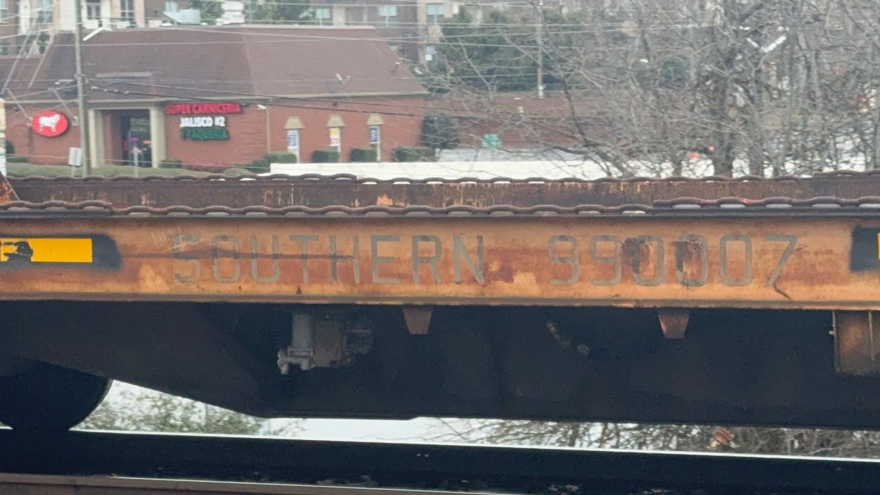 A monstrous NS 154 rolls by Duluth,GA with some old Southern rolling stock filmed February 26th 2026