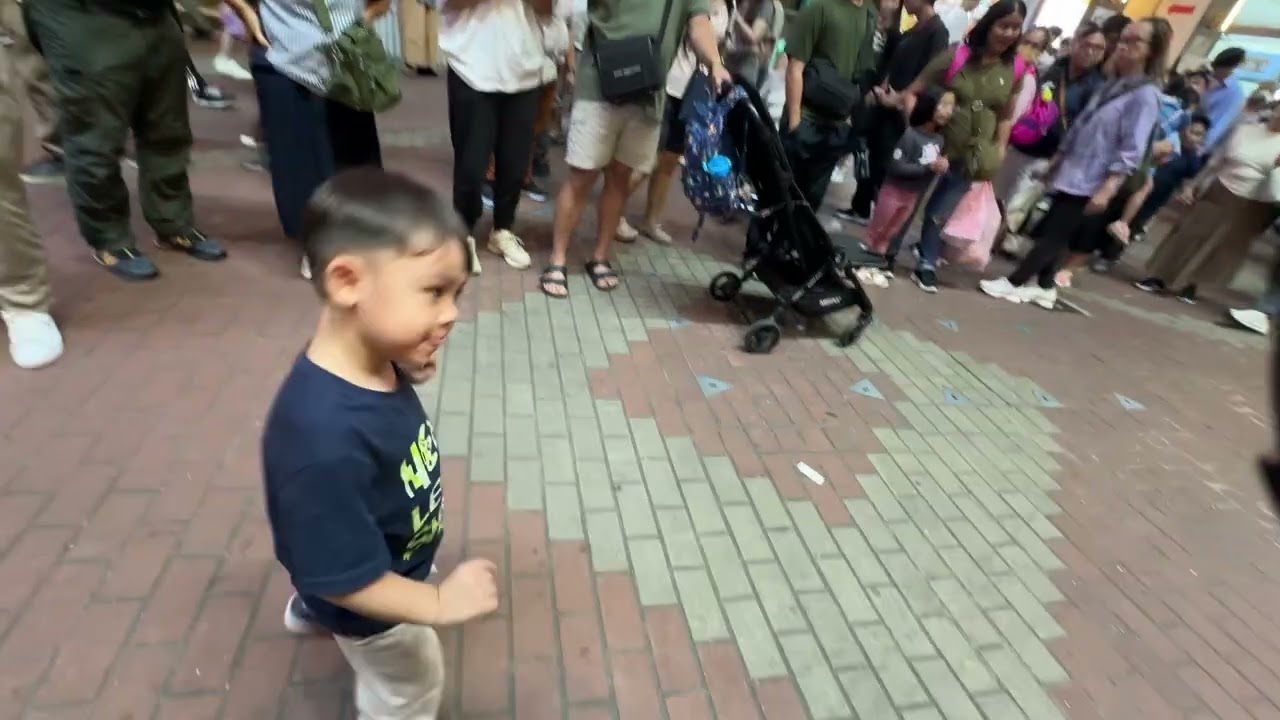 Troy dancing on the street in Hong Kong 