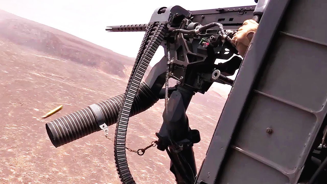 HH-60 Helicopter Door Gunner In Action