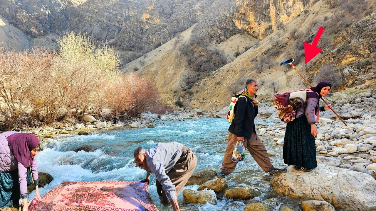 Nomadic couple go to the river to wash blankets