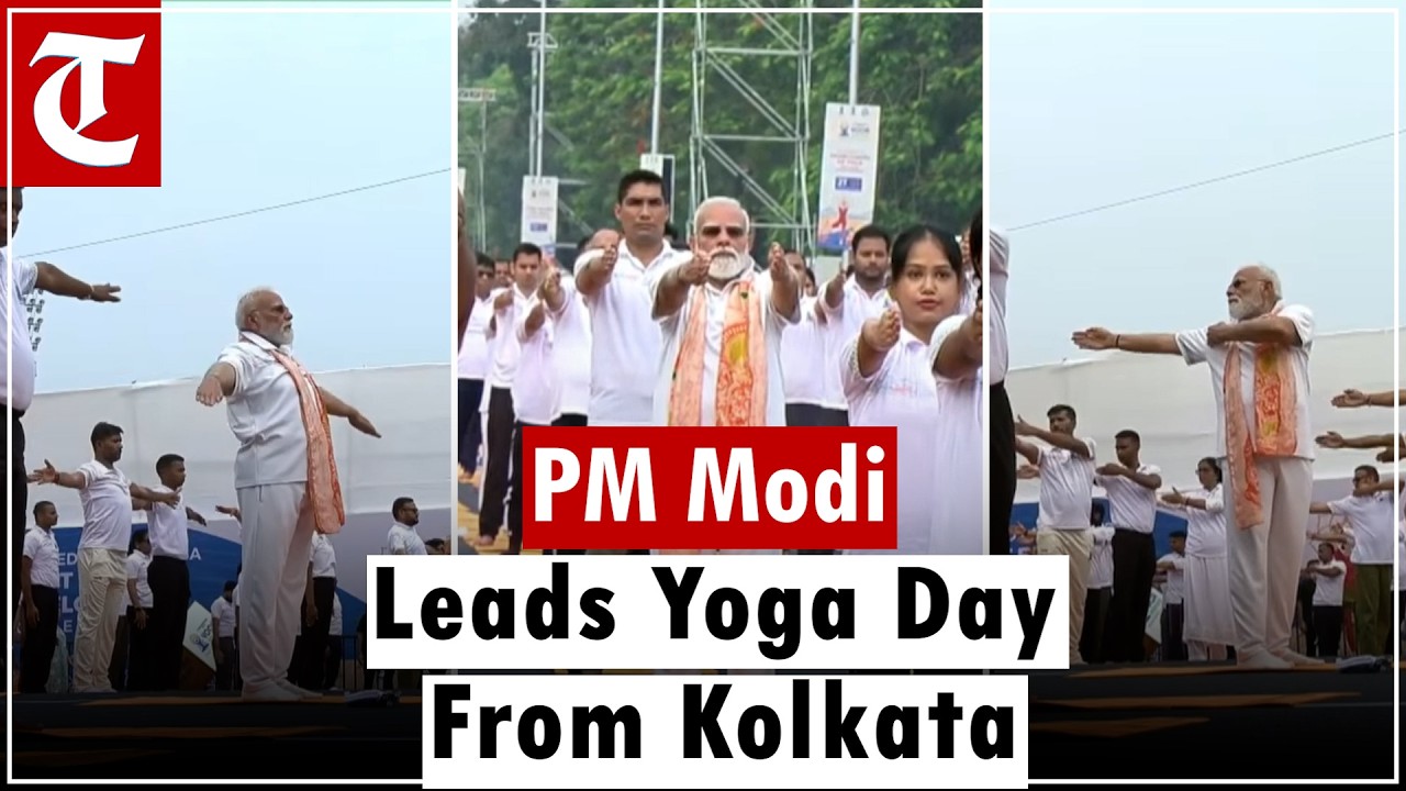 PM Modi assists Yoga participants on International Yoga Day at red Road, Kolkata