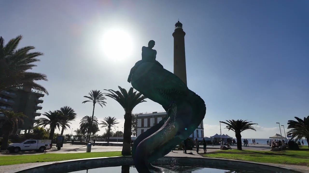 A walk around Maspalomas Lighthouse and beach, plus the palm trees and exotic hotels.