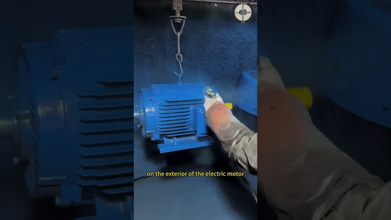 Workers spray blue anti-oxidation paint on the exterior of the electric motor