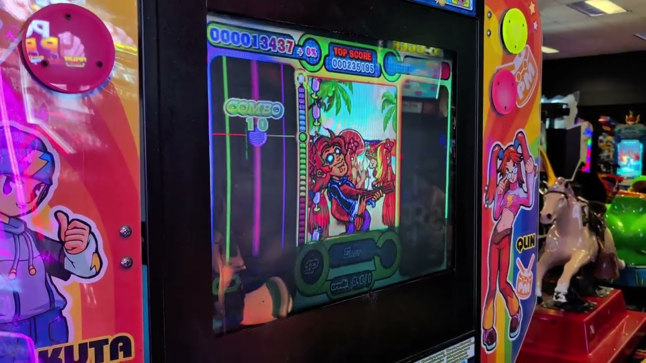 Me playing Percussion Master arcade game by IGS at Pinballz Lake Creek