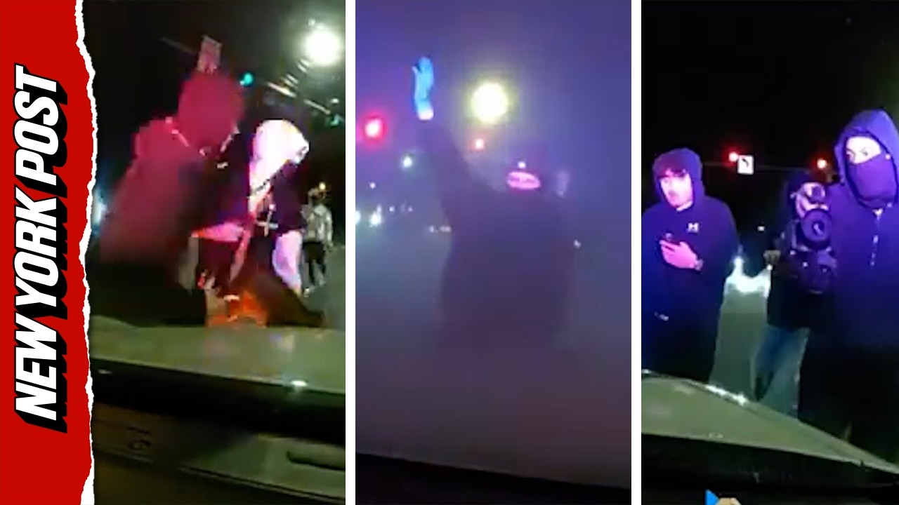 Masked Mob Attacks Police Car With Officer Inside During Illegal Street Takeover