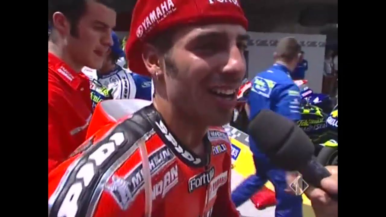 MOTOGP 2004 (CATALUNYA) - PAOLO BELTRAMO INTERVISTA MARCO MELANDRI DOPO LA GARA