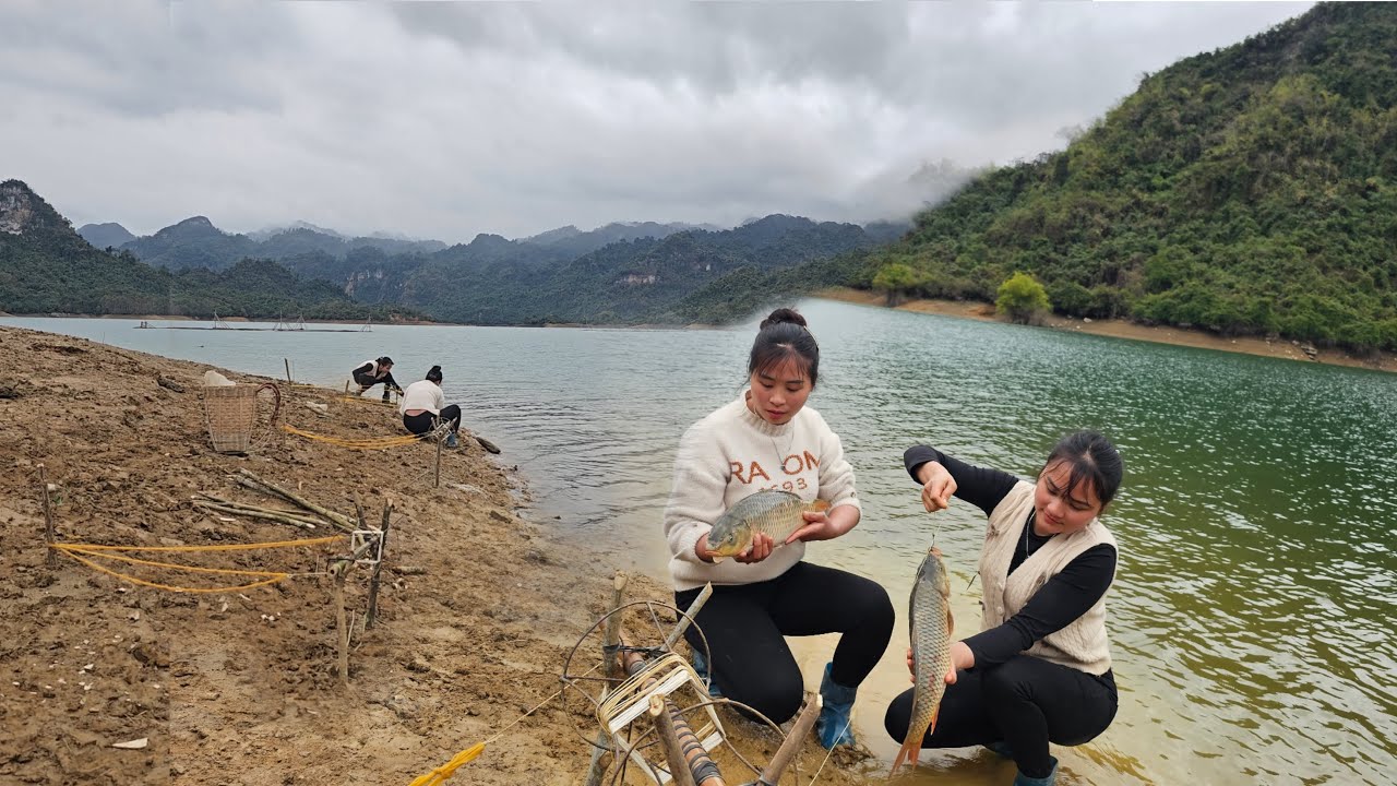 Fish trap, two sisters demonstrate excellent fish catching skills on the lake.