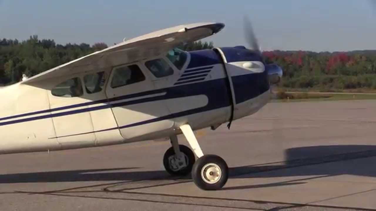 A Cessna 195 Departs West Branch (Michigan) Airport. Y31