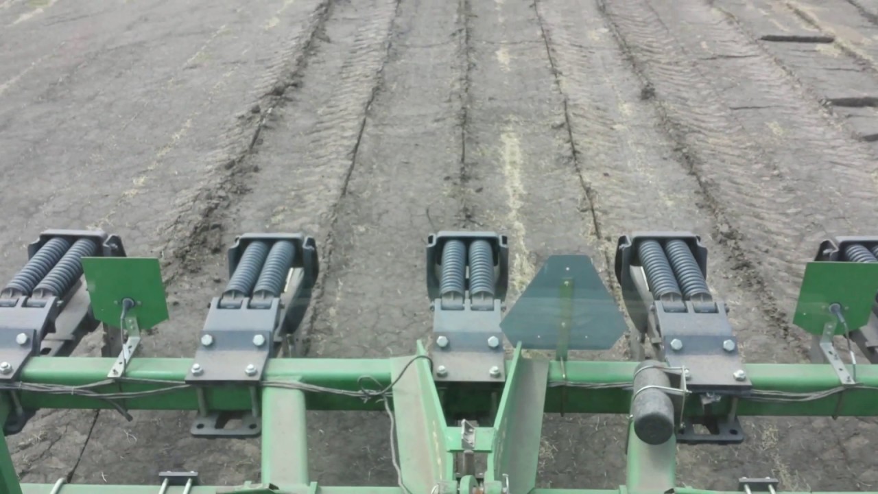 Inline ripping highly compacted ground
