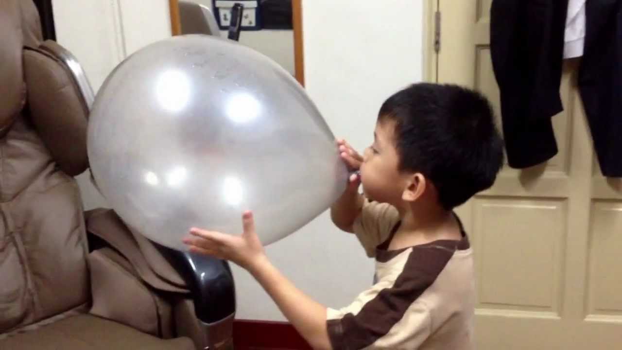 Zheng Yong blowing a BIG balloon!