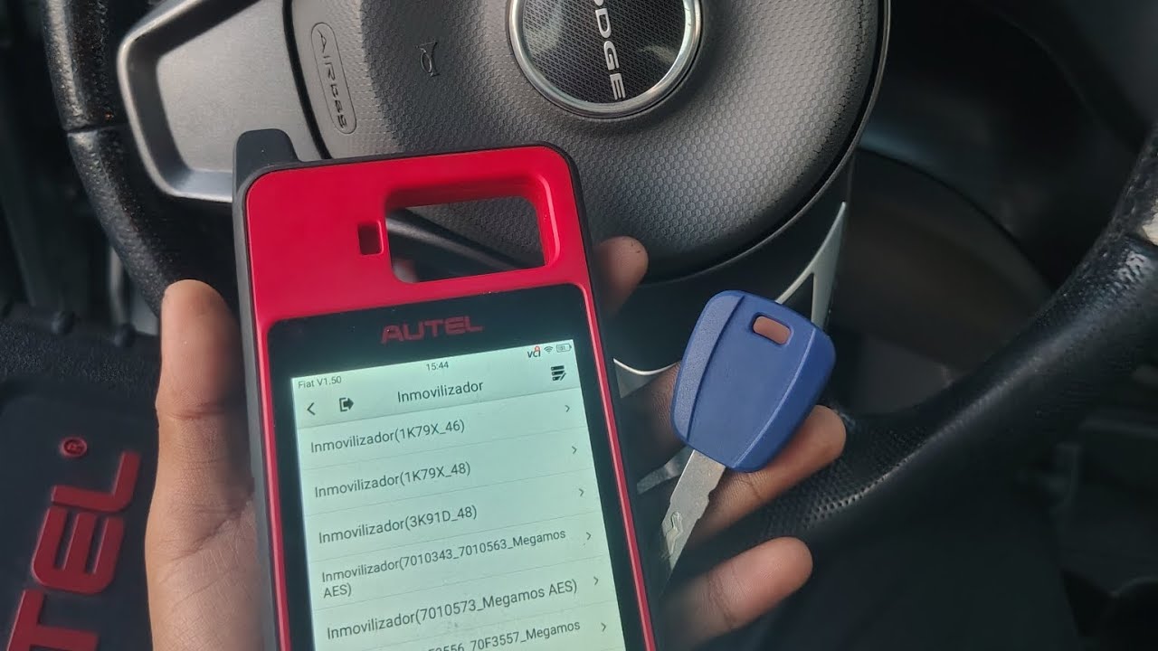AKL Dodge visión 2016 con autel KM100 programación de llave por perdida 