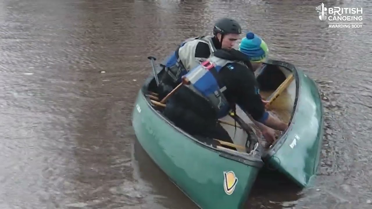Open Canoe Rescue - emptying a capsized canoe with help / curl