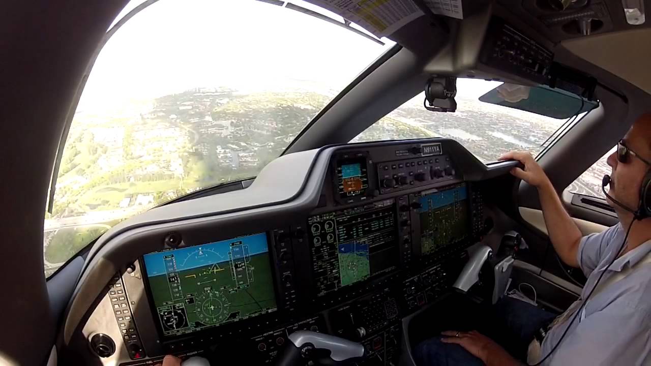 Embraer Phenom 100 landing at Opa Locka (KOPF)