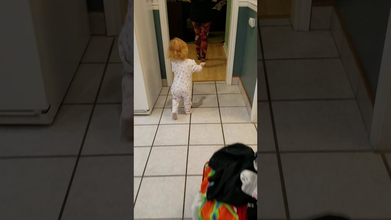 Super cute little toddler girl run.   Ginger Redhead baby.