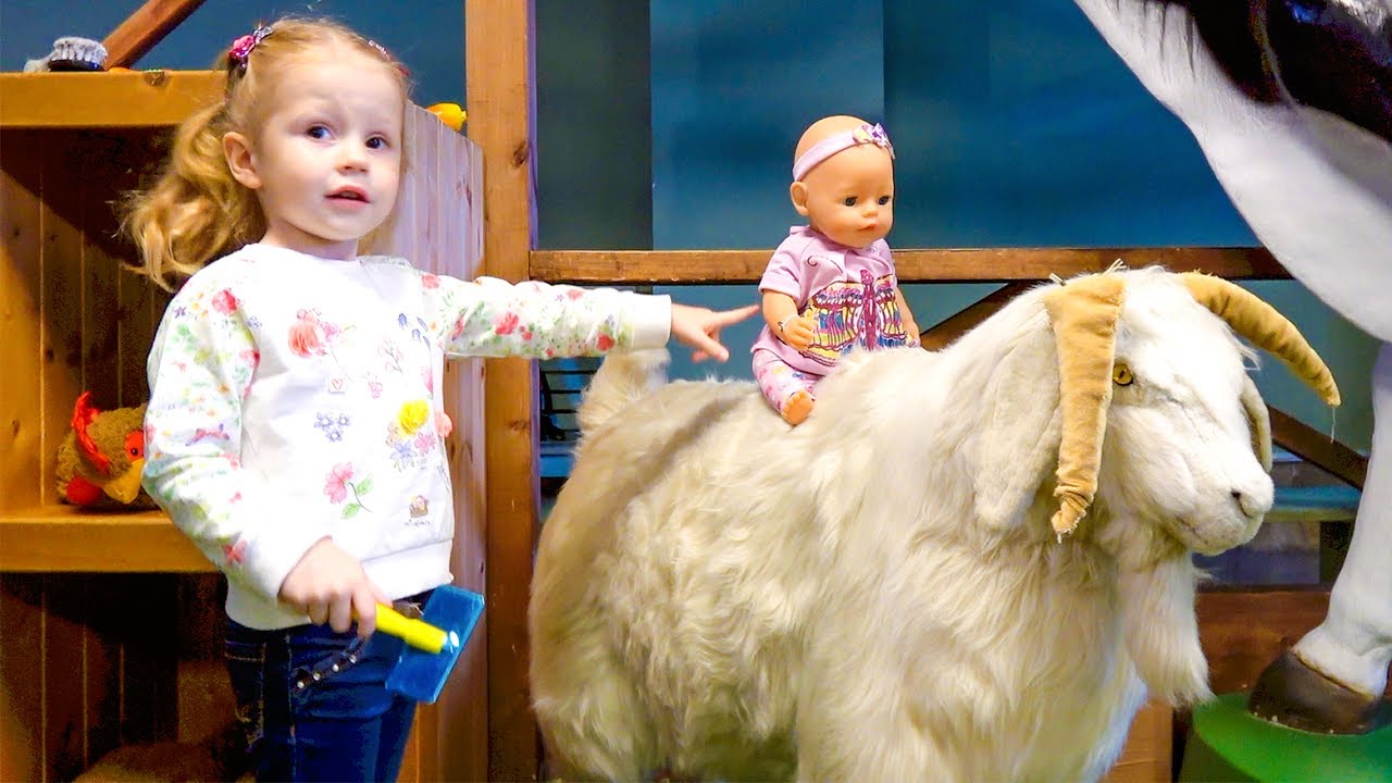 Funny Stacy playing with animals on farm