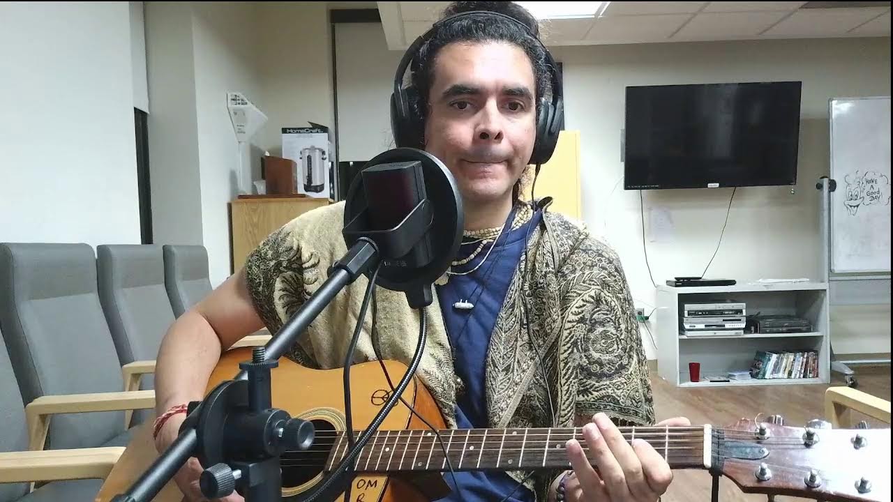 Om playing some acoustic guitar and singing