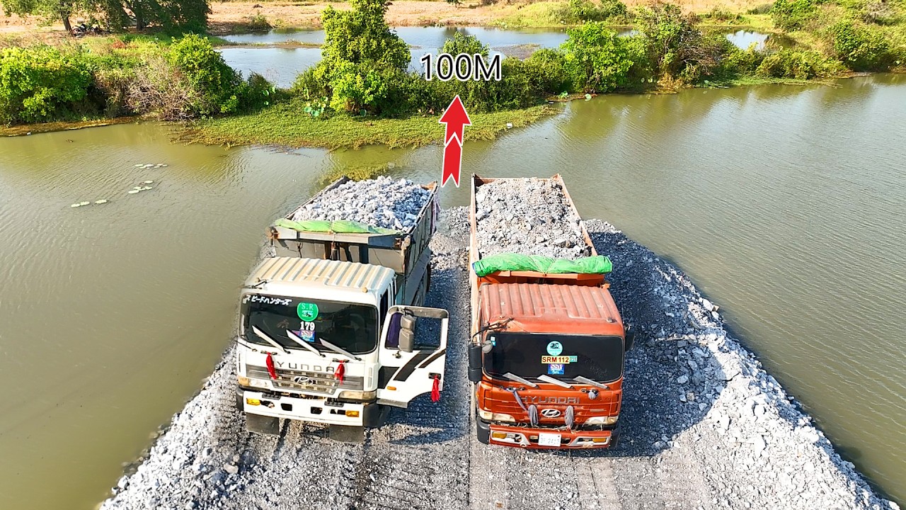 O.M.G, NEW road construction work covers 65%& trucks and SHANTUI dozer pushing rocks into the water.