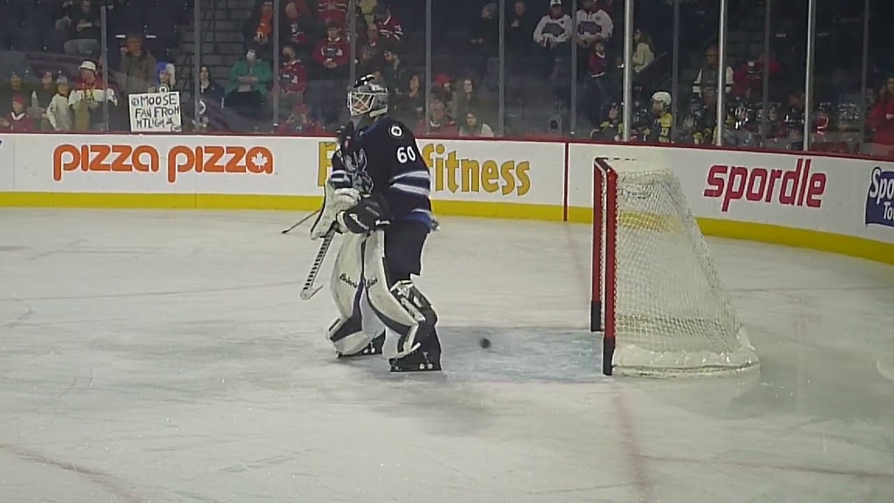 Manitoba Moose goalie Collin Delia warms up 1/12/24