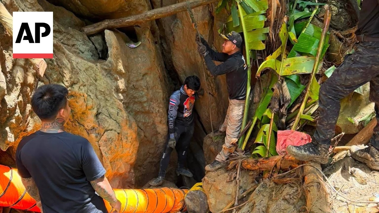 Rescuers race to reach 7 people trapped inside flooded cave in Laos