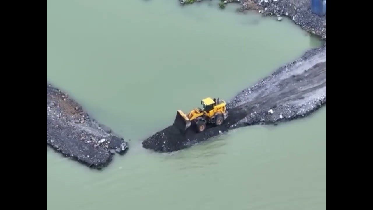 Carrying rocks to fill the sea to build a highway to the island #excavator   #fypシ   #automobile