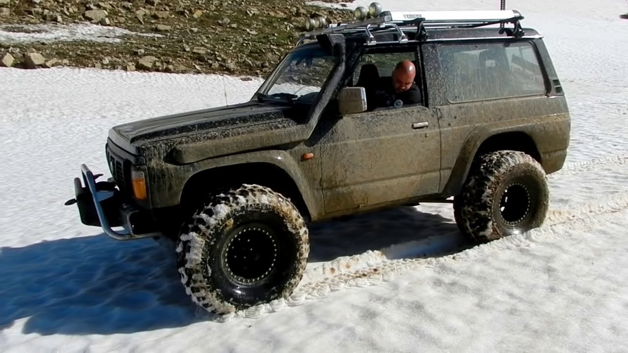 Nissan Patrol and Range Rover on snow and mud