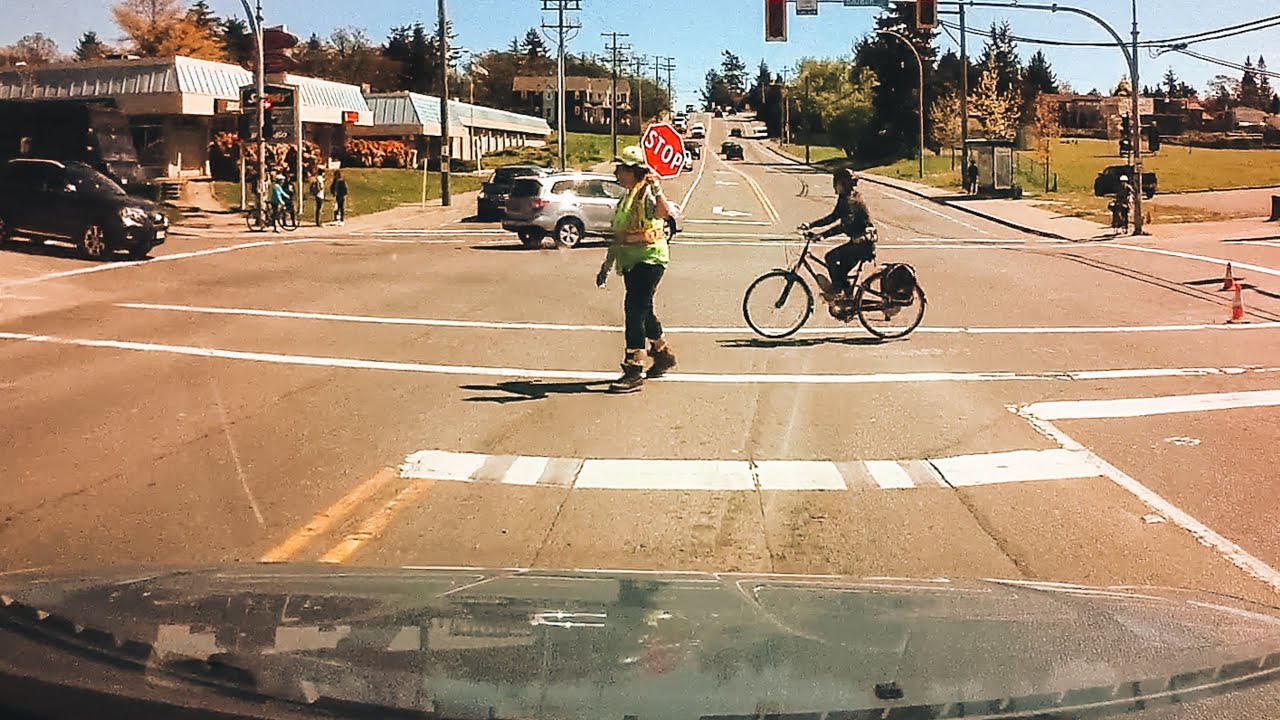 Left Turn at an Intersection with Construction: Navigating Flag Person Instructions
