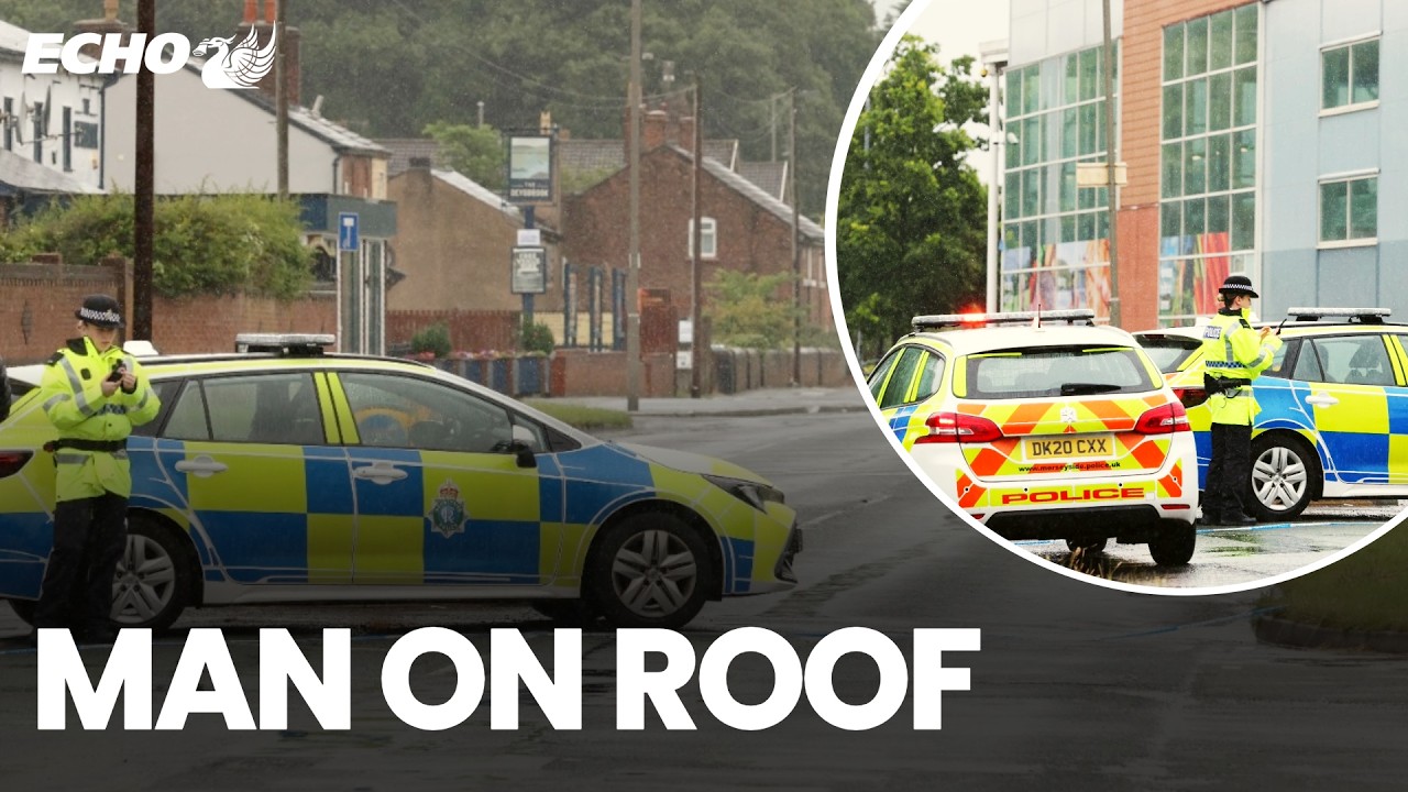 Police close road as man on TESCO ROOF