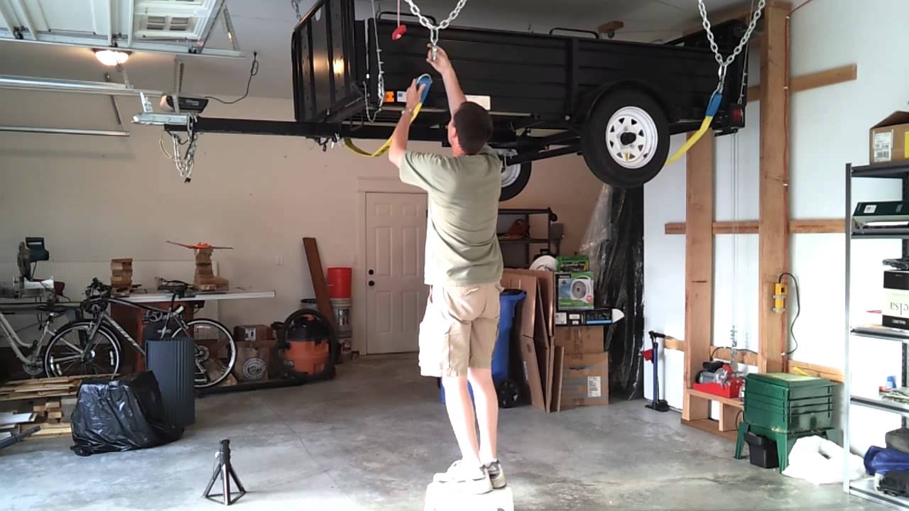 Hang my utility trailer from the garage ceiling.