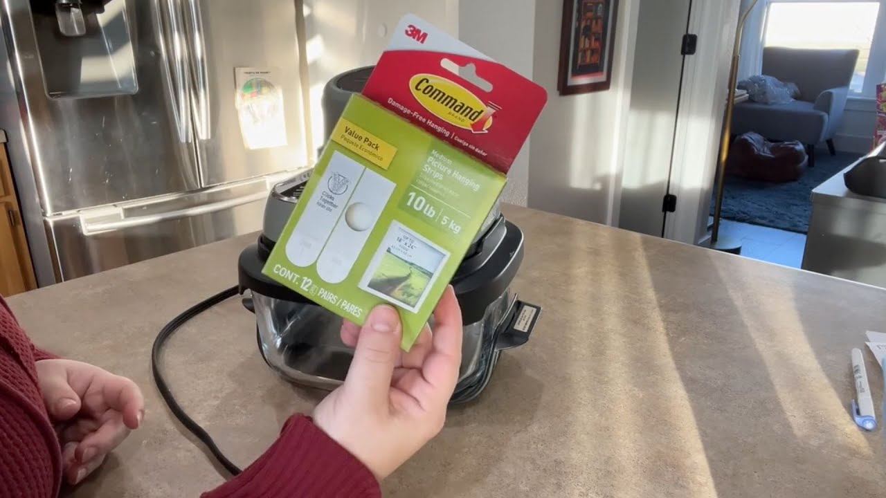 Stick a command strip on your trash can (this is GENIUS!)