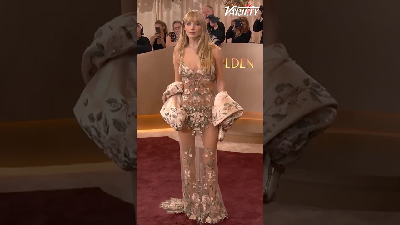 Jennifer Lawrence walks the red carpet at the Golden Globes