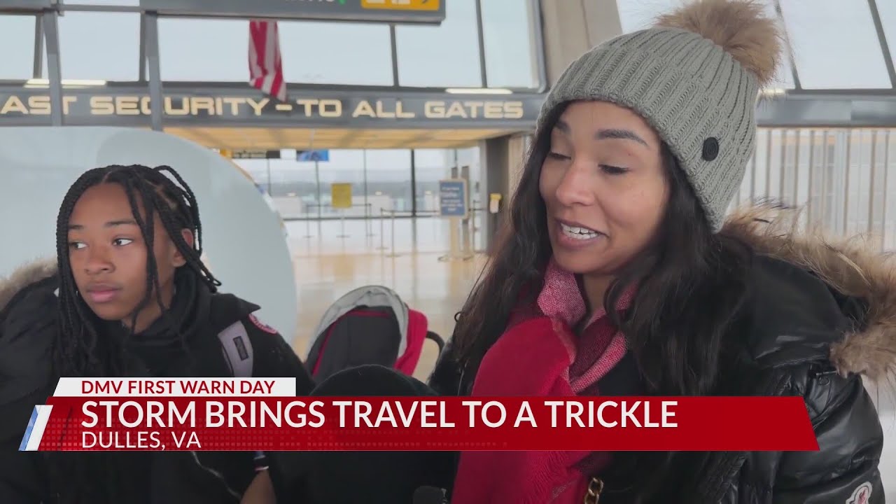 Passenger at Washington Dulles Airport reacts after flights delayed, canceled
