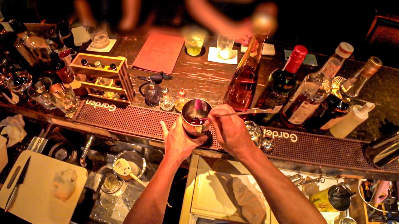 POV: Flair Bartender Skillfully Mixing 100 Drinks Daily