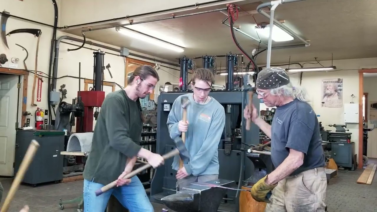Rhythmic forging with 3 sledges and dundun and bell accompaniment