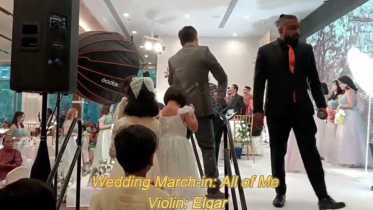 Singapore violinist performs for a wedding march-in