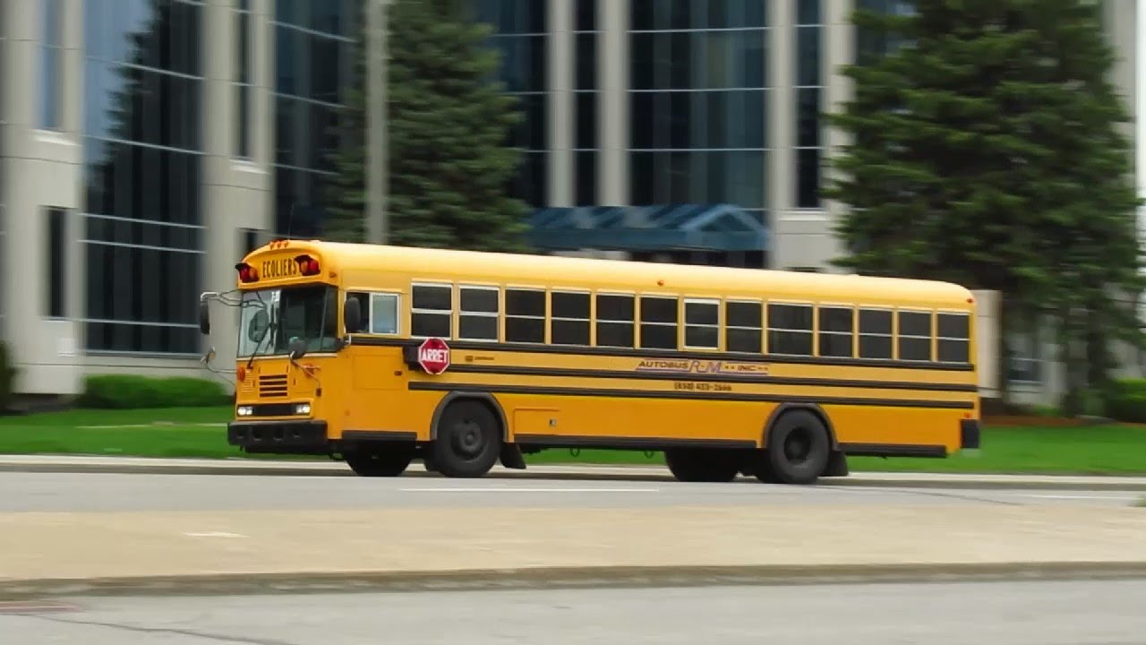 SCHOOL BUSES DRIVING IN MONTREAL QUEBEC APRIL - MAY 2021