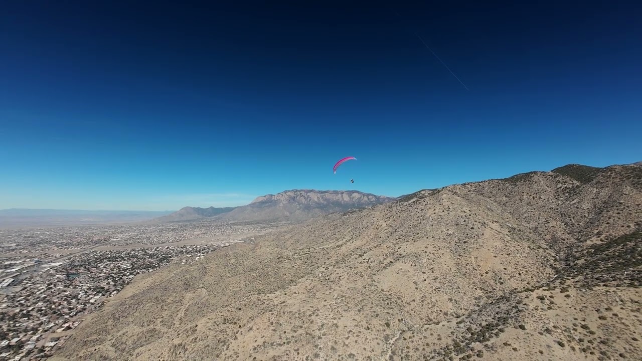 Jeff Wayland flying a paraglider over East Albuquerque