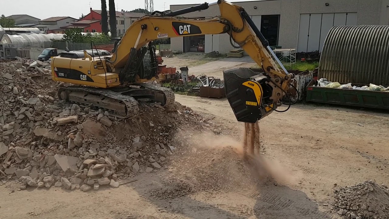 BF120.4 Crusher Bucket on Caterpillar Crushing Concrete