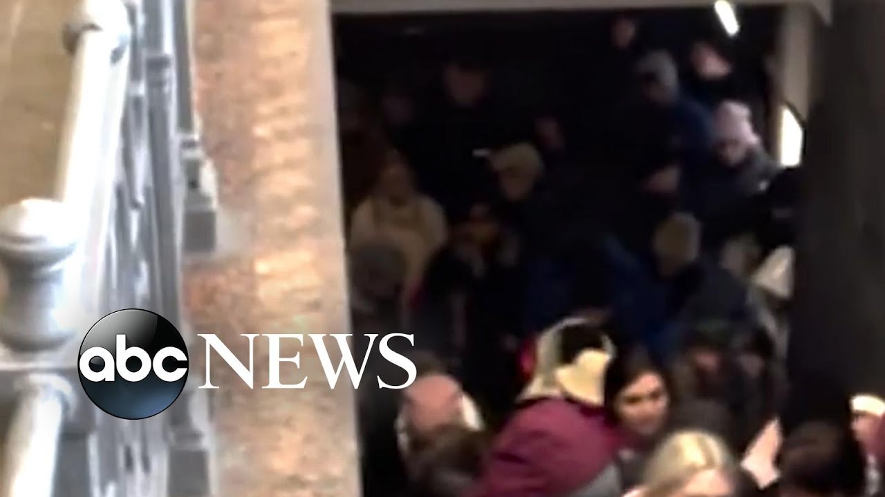 Hundreds wait to board at train station in Ukraine