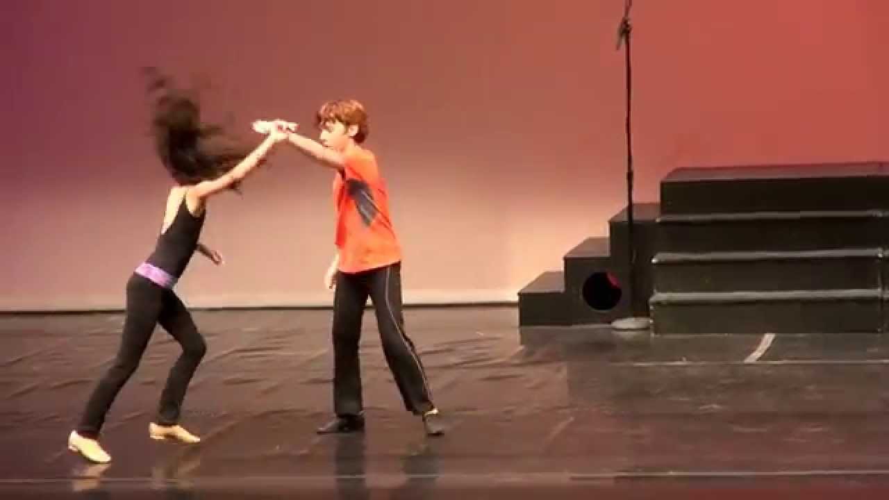 Yasha and Daniela rehearse a Chacha routine on the Alliance theater stage