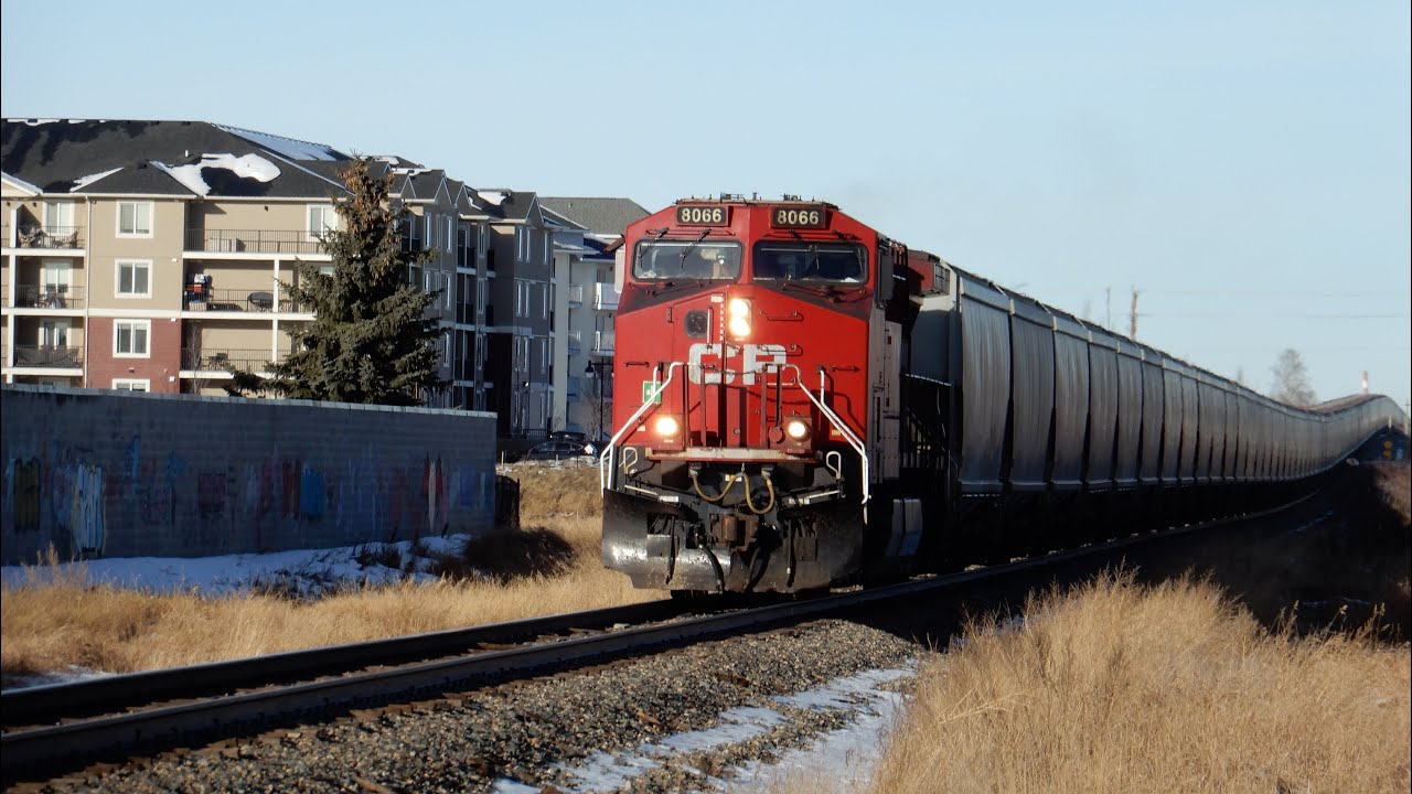 Friendly Conductor! CP 8066 Leads CP Grain Train South with CPKC T4 at the Rear. 
