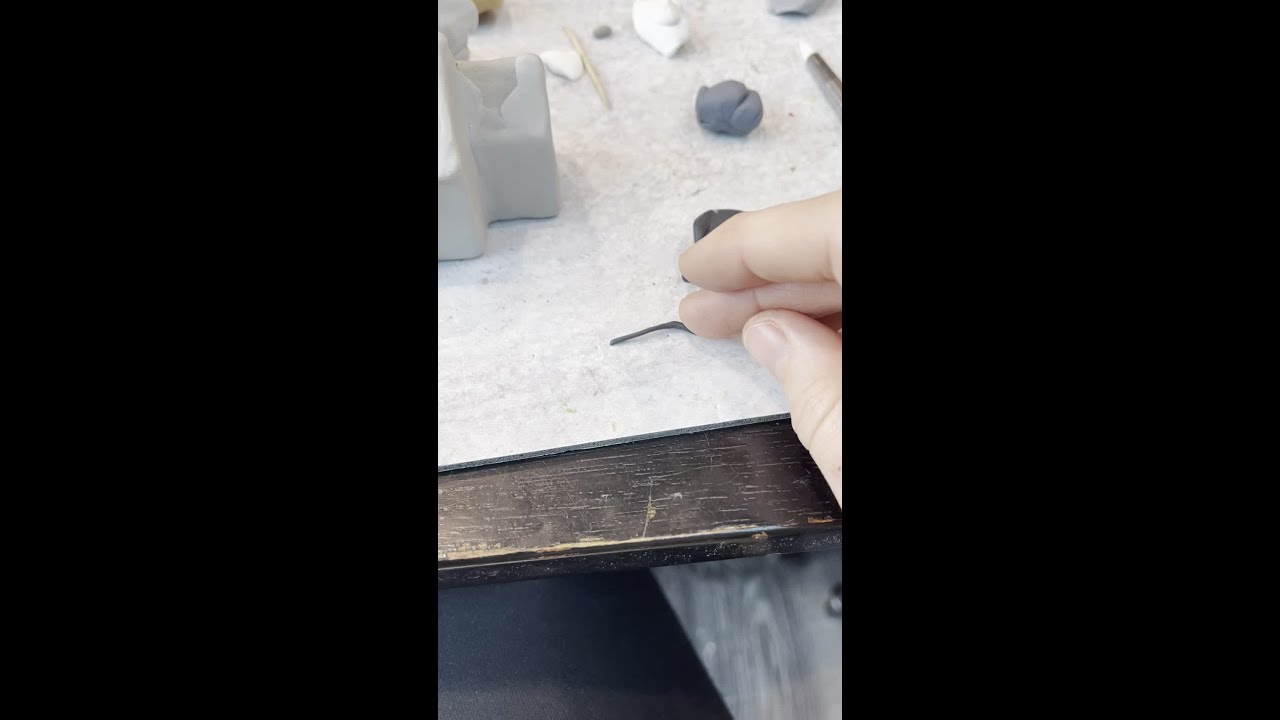 This is how I create lettering on any of my sculptures. I roll out teeny pieces of clay...