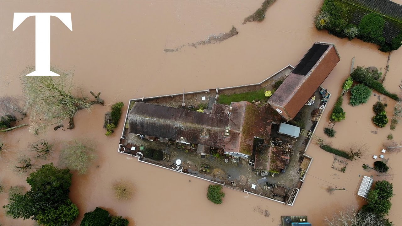 Marooned on flood island: Couple build 110m wall to protect house