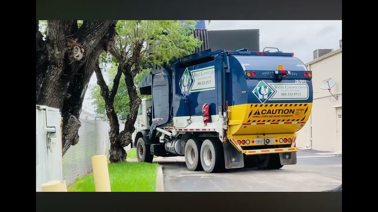 A Waste connections fl Mack MRU 207001  on dumpster city of Miami dade