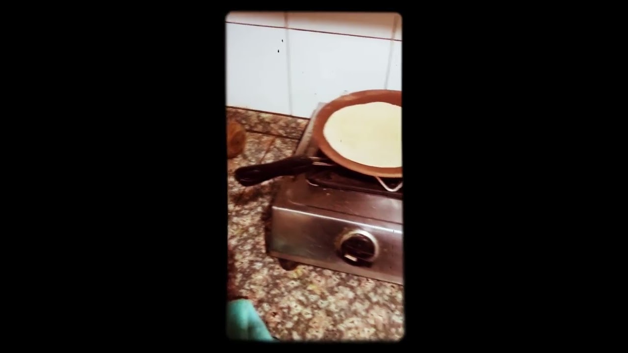 Making roti on clay tawa