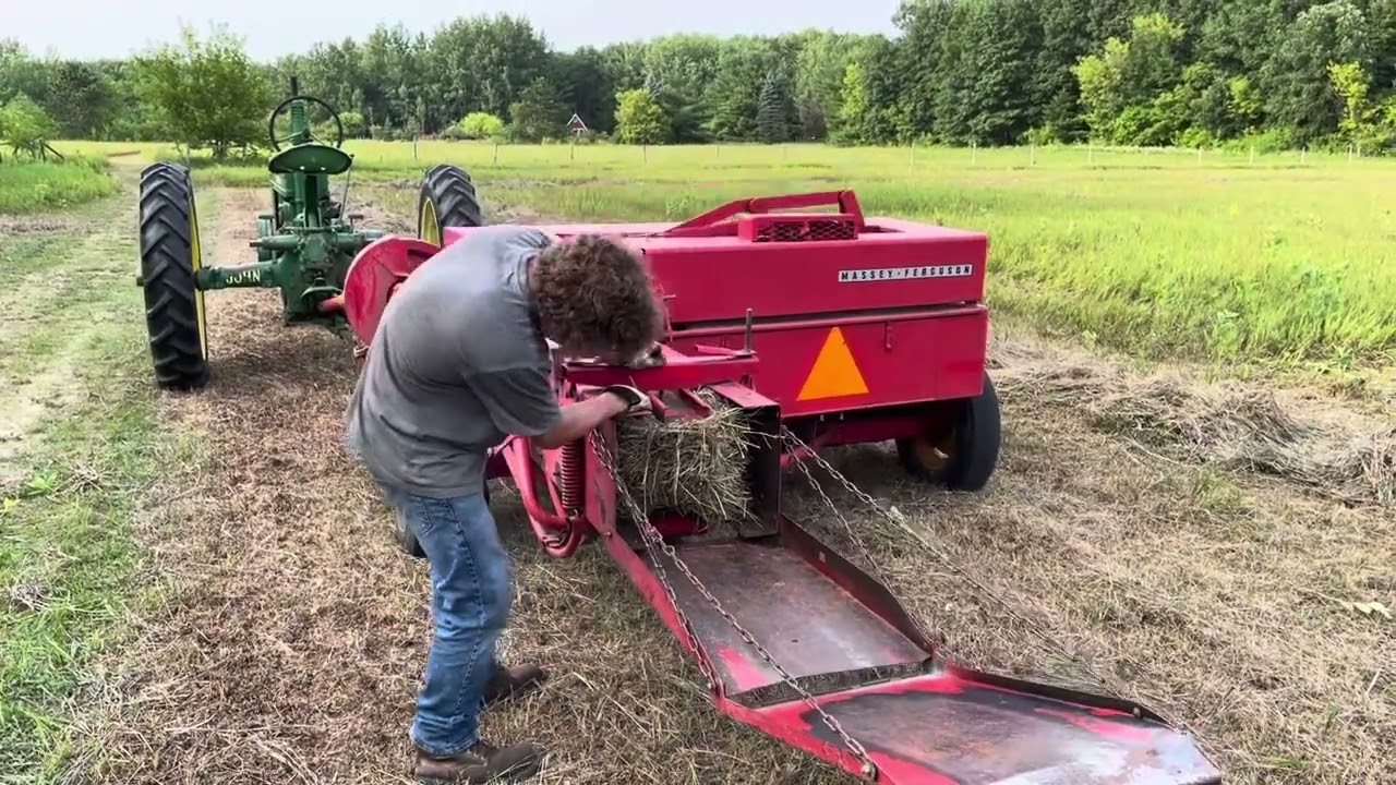 Raking and baling hay with old farm machinery